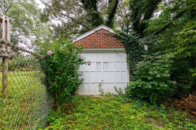 a top view of a house with a small yard and plants