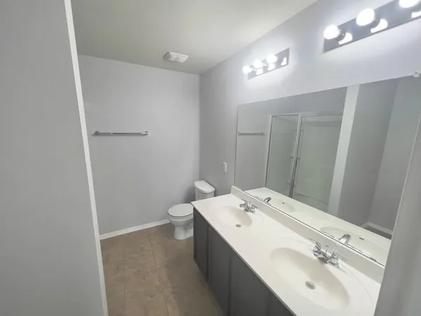 a bathroom with a sink and mirror