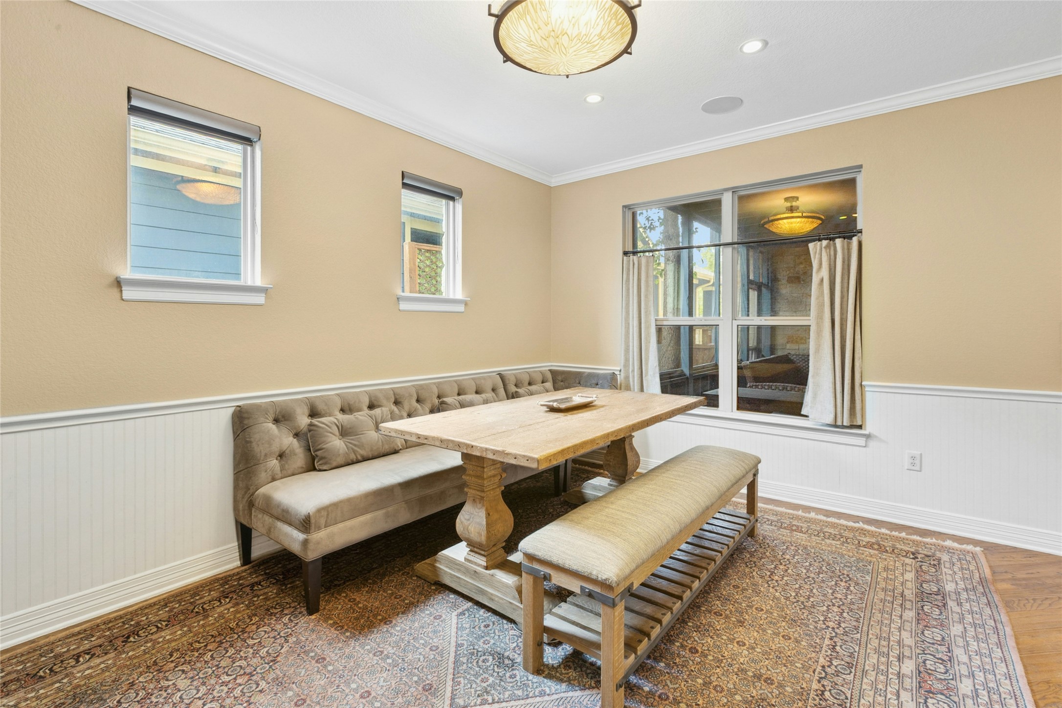 1912 Antone Street Austin, TX 78723 - Photo 14 of 38 Dining room with a wainscoted wall, ornamental molding, recessed lighting, and wood finished floors