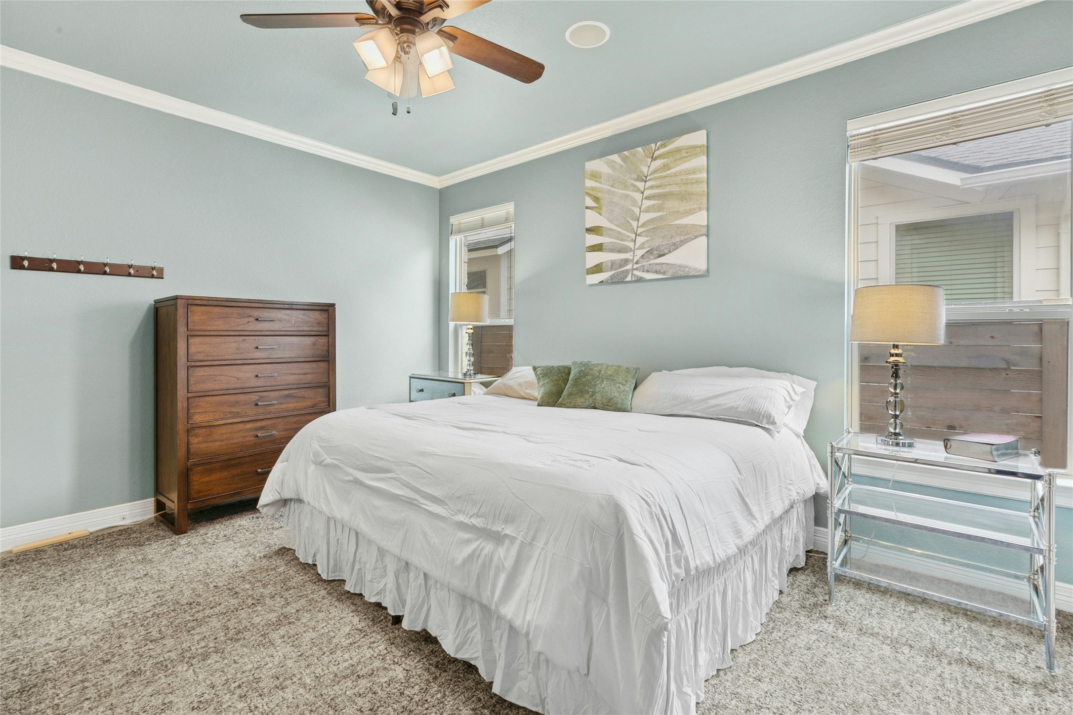 1912 Antone Street Austin, TX 78723 - Photo 17 of 38 Master bedroom with ornamental molding and a ceiling fan