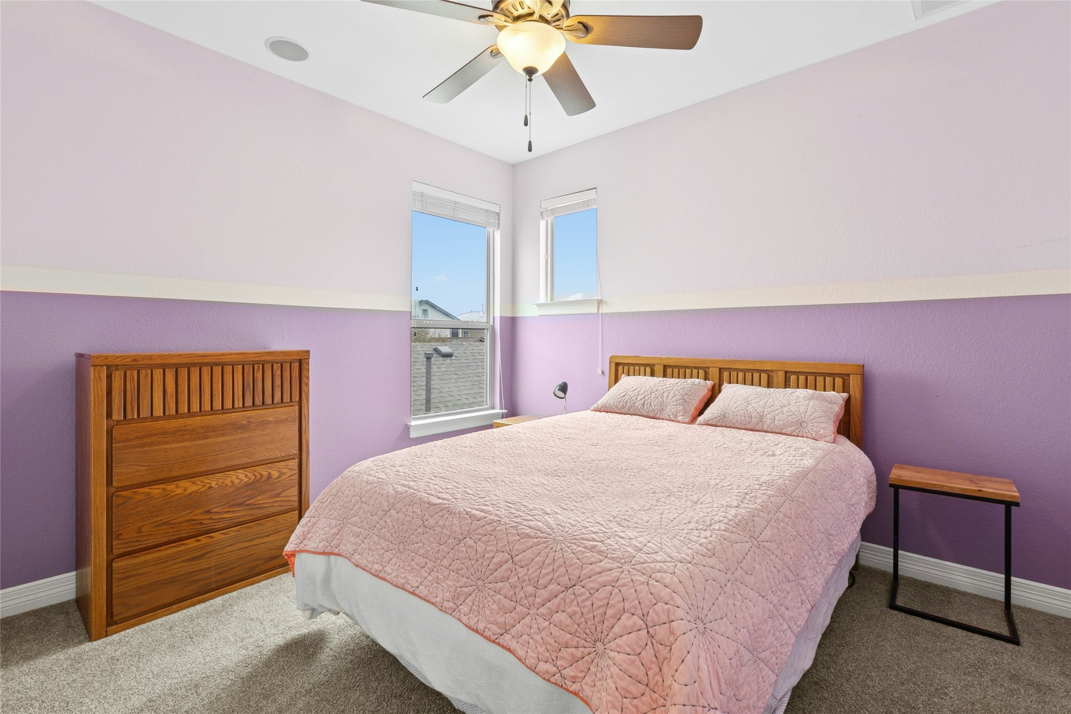1912 Antone Street Austin, TX 78723 - Photo 29 of 38 Carpeted bedroom 2 with baseboards and ceiling fan