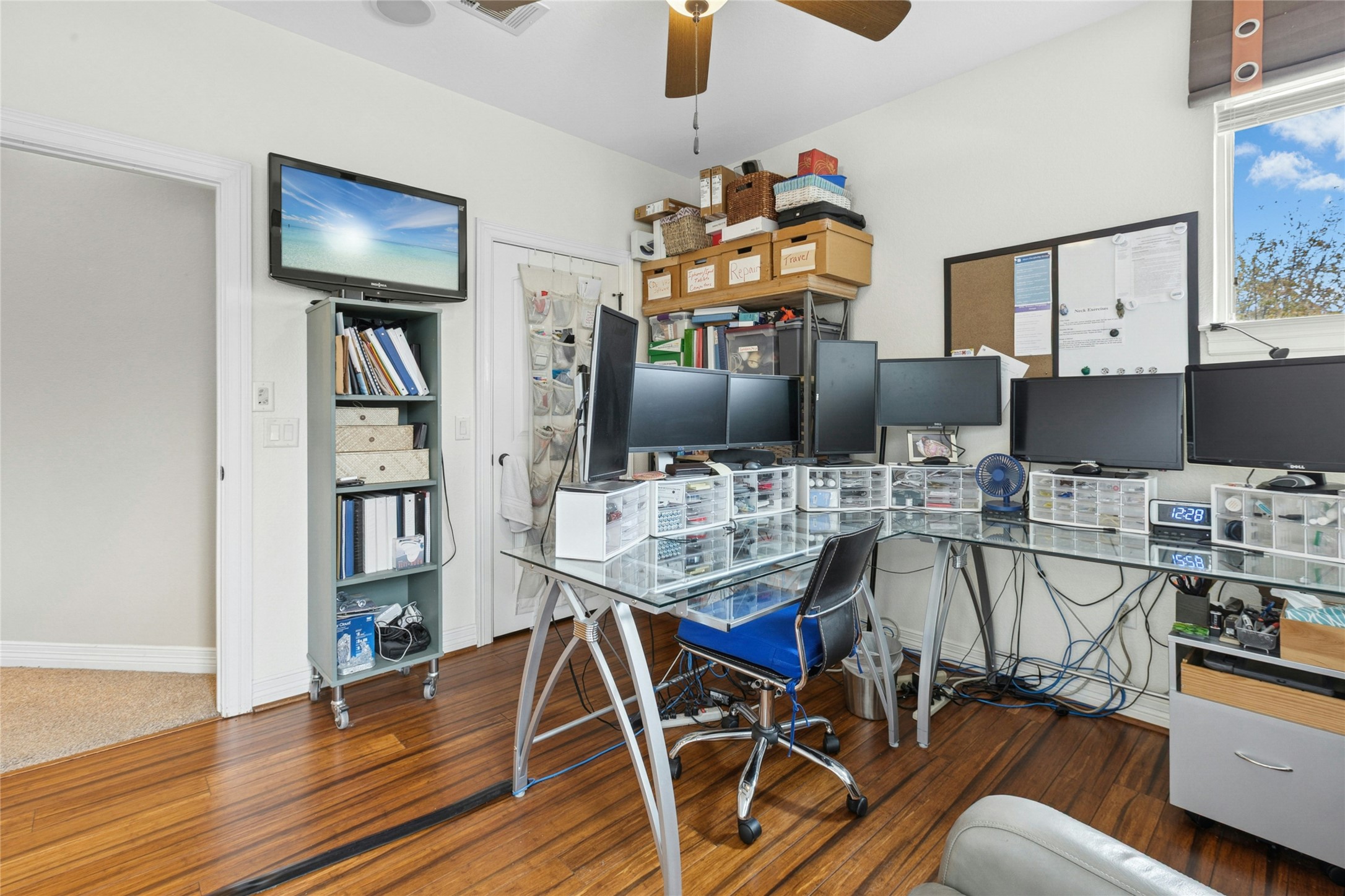 1912 Antone Street Austin, TX 78723 - Photo 30 of 38 Home office with a ceiling fan and wood finished floors. Optional bedroom 3