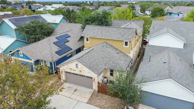 an aerial view of a house with a garden