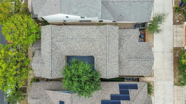 a aerial view of a house with a yard and plants