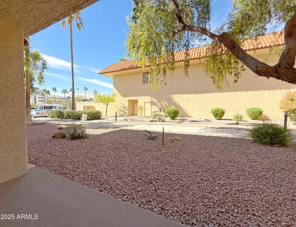 a view of a backyard of the house