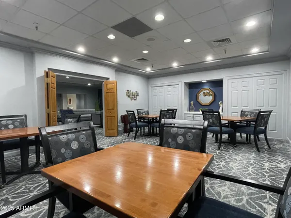a room with a table and chairs