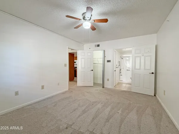 a view of empty room with fan