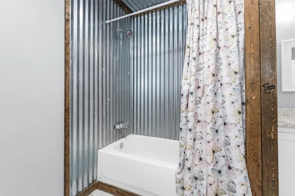 a kitchen with a refrigerator and a stove