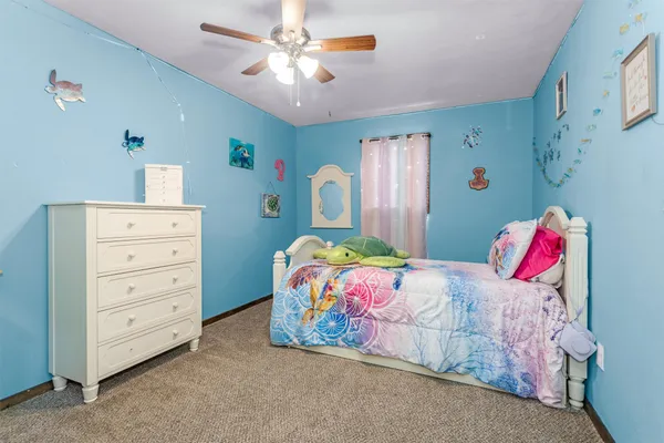 a bedroom with a bed and cabinets