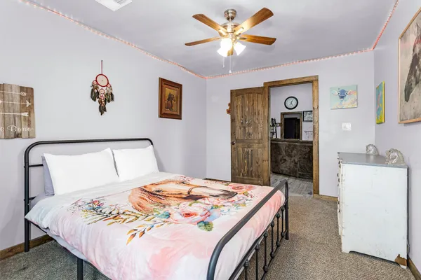 a bathroom with a granite countertop sink a toilet and a mirror