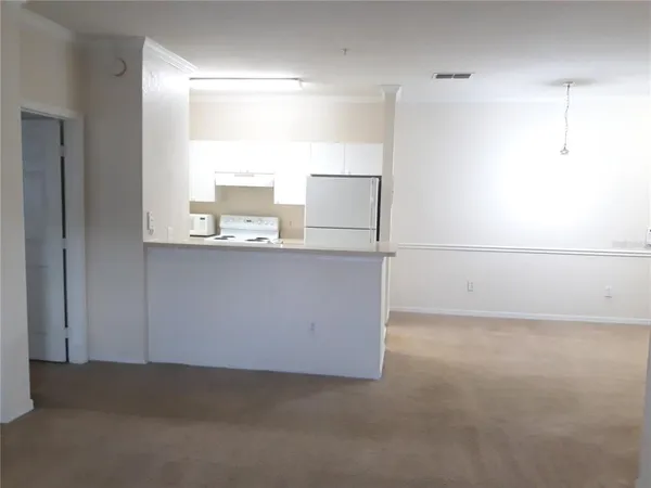 a kitchen with appliances and cabinets