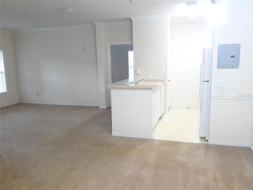 3589 Conroy Road, Unit 1021 Orlando, FL 32839 - Photo 13 of 13 a view of kitchen and utility room