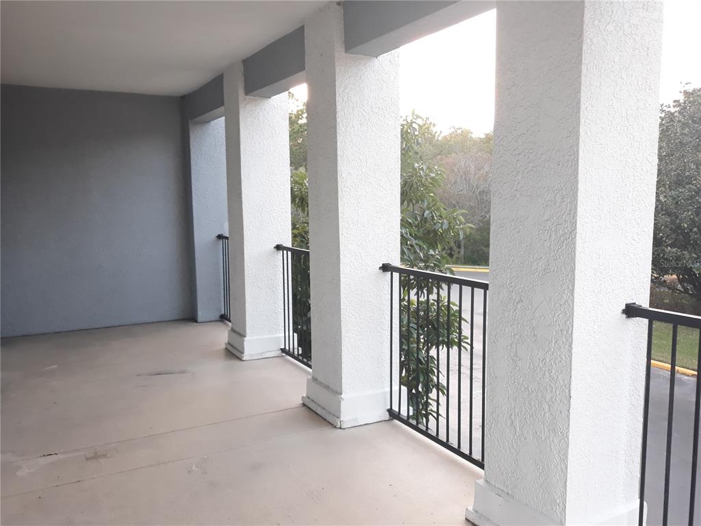 3589 Conroy Road, Unit 1021 Orlando, FL 32839 - Photo 2 of 13 a view of entryway with floor to ceiling window