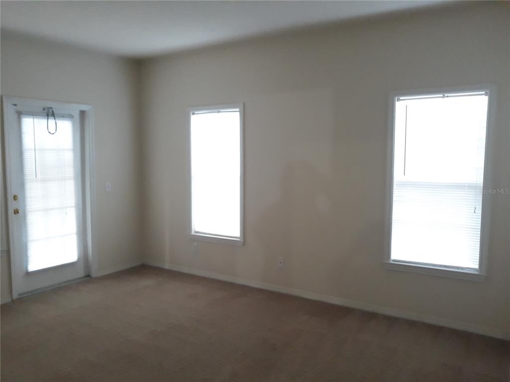 3589 Conroy Road, Unit 1021 Orlando, FL 32839 - Photo 8 of 13 an empty room with a window