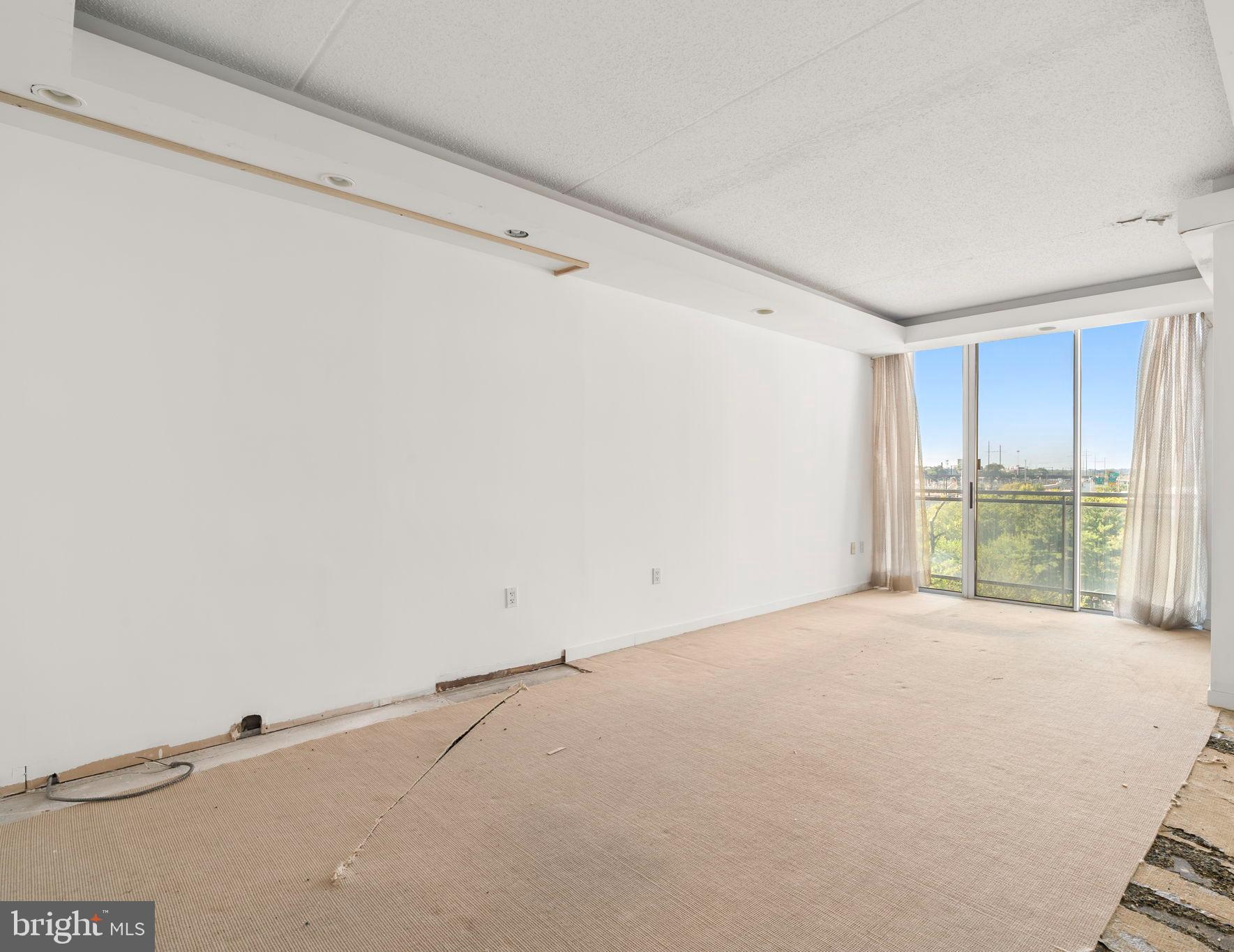 2301 Cherry Street, Unit 5F Philadelphia, PA 19103 - Photo 8 of 26 a view of an empty room with a window