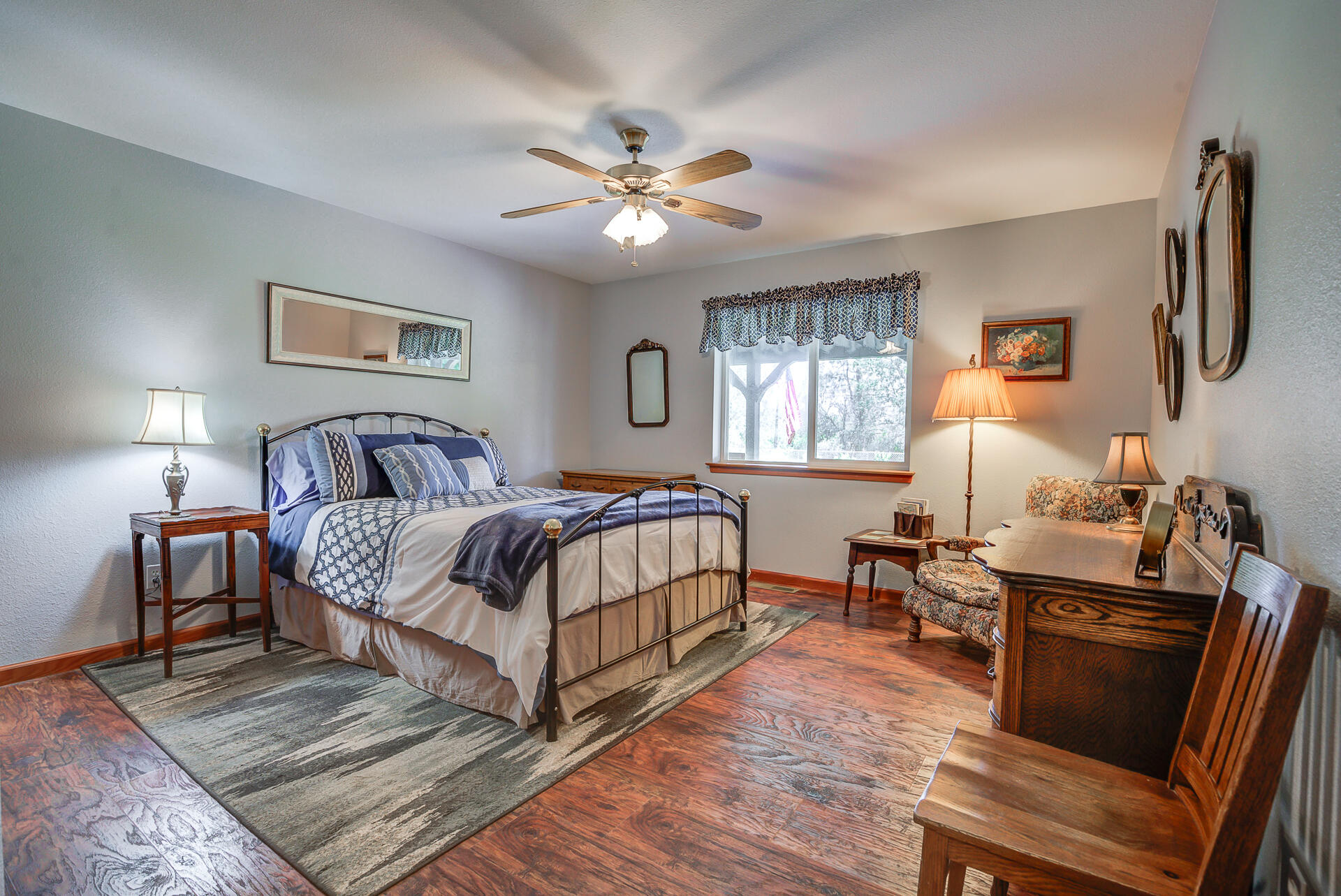 17536 Oly Way Anderson, CA 96007 - Photo 20 of 51 a bedroom with a bed and wooden floor