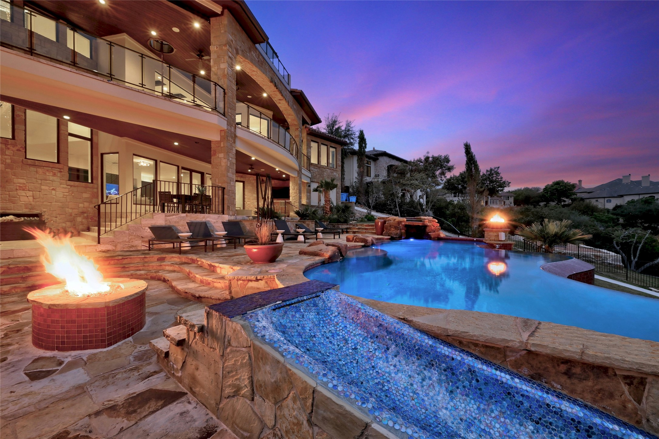 a view of a swimming pool with outdoor seating