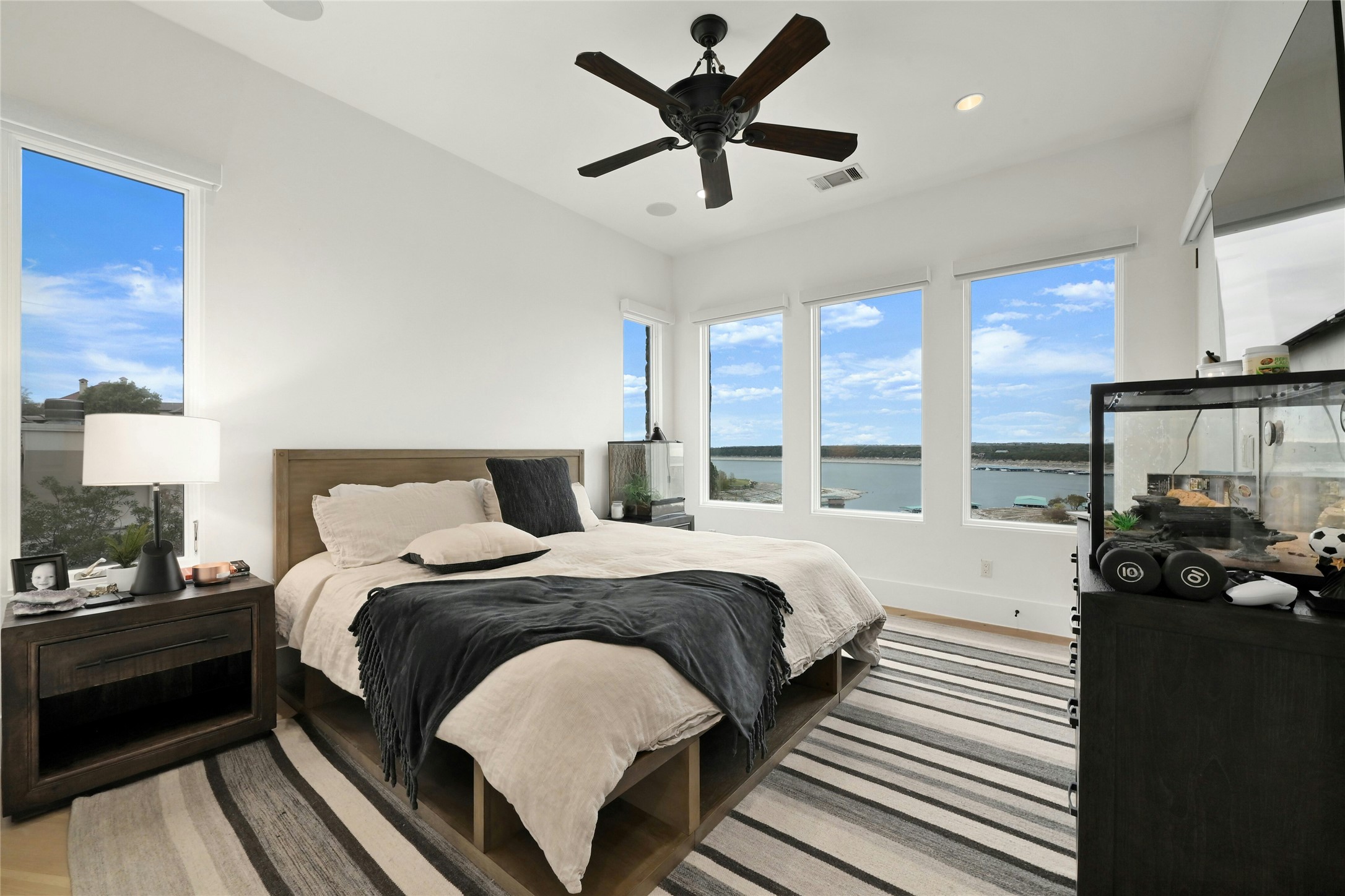 16012 Canard Circle Austin, TX 78734 - Photo 16 of 37 a bedroom with a bed and a large window