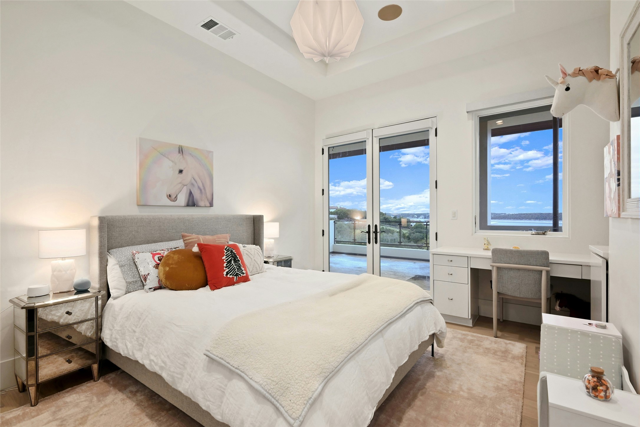 16012 Canard Circle Austin, TX 78734 - Photo 18 of 37 a bedroom with a bed and a table