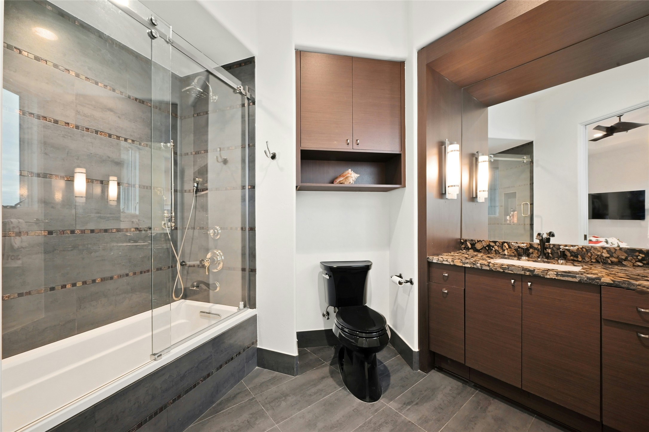 16012 Canard Circle Austin, TX 78734 - Photo 21 of 37 a bathroom with a tub a sink and a large mirror