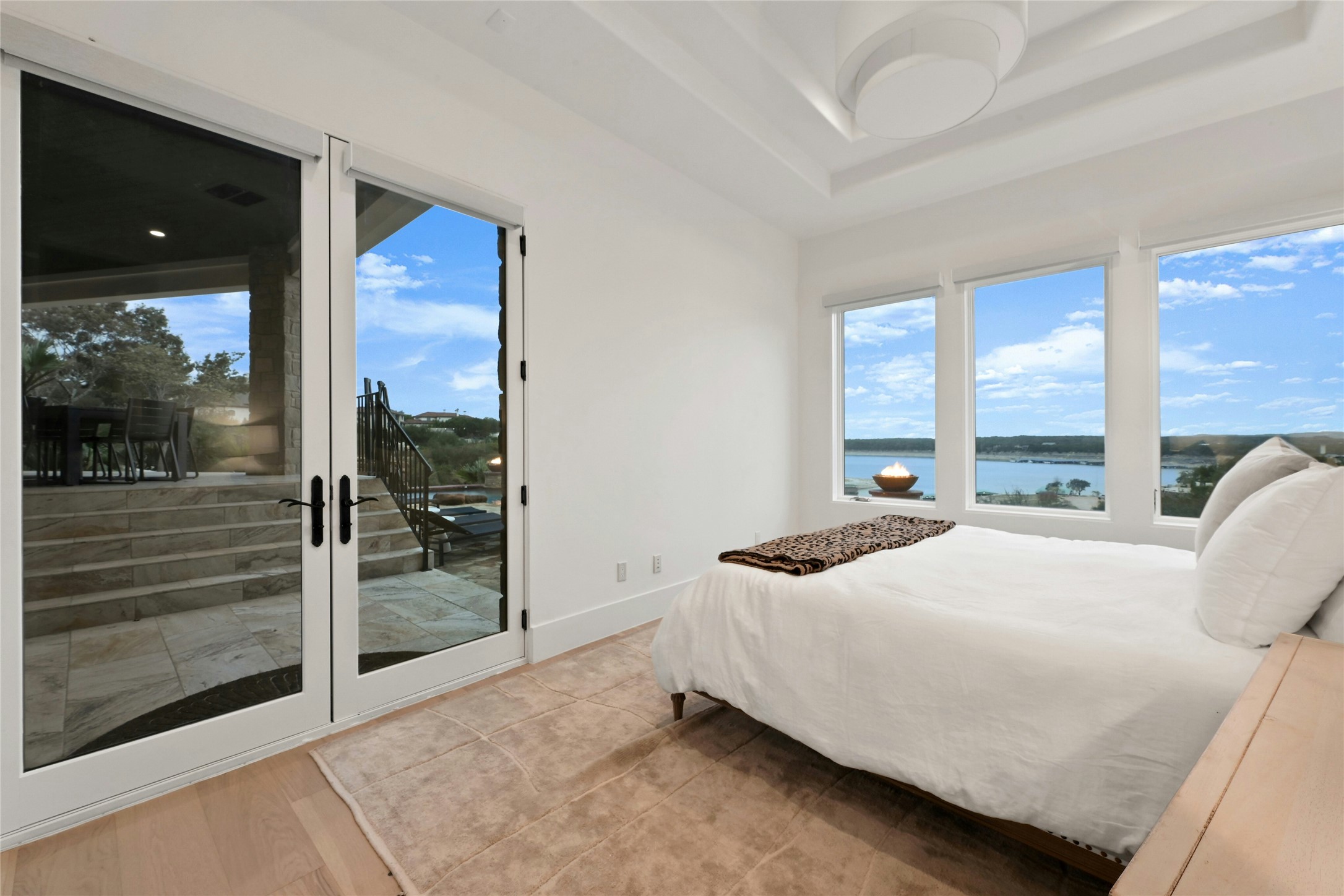 16012 Canard Circle Austin, TX 78734 - Photo 25 of 37 a bedroom with a bed and large window