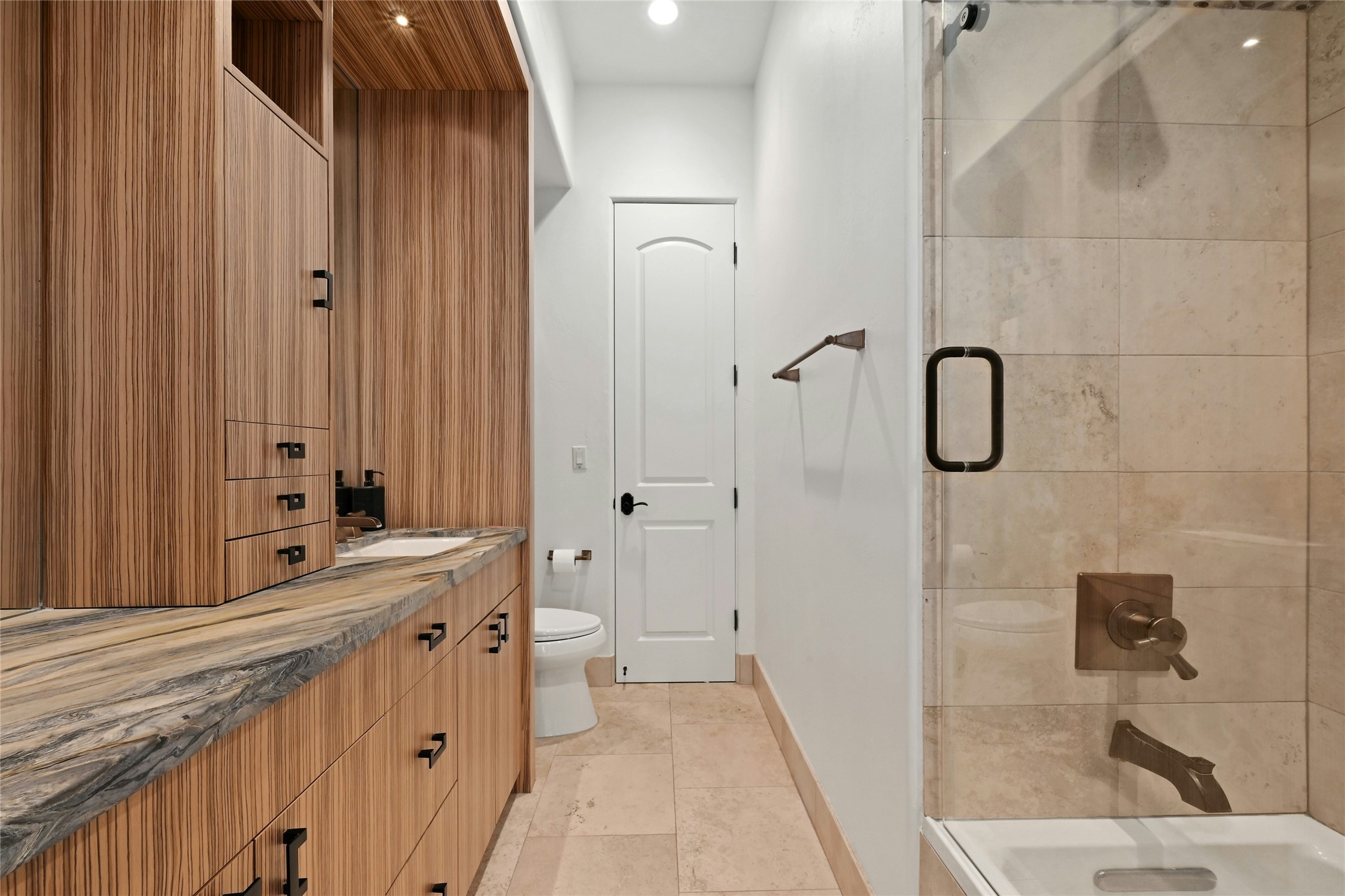 16012 Canard Circle Austin, TX 78734 - Photo 28 of 37 a bathroom with a double vanity sink and a mirror