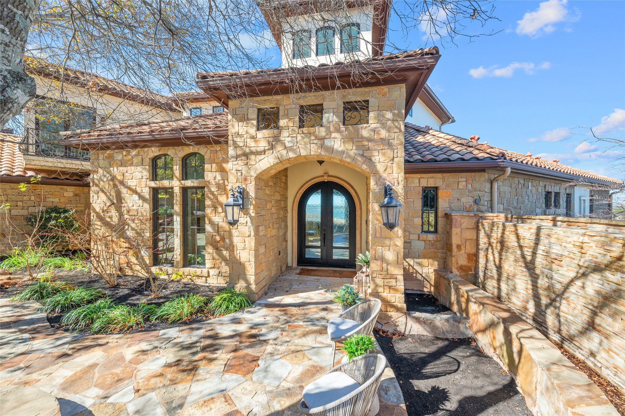 16012 Canard Circle Austin, TX 78734 - Photo 4 of 37 a front view of a house with garden
