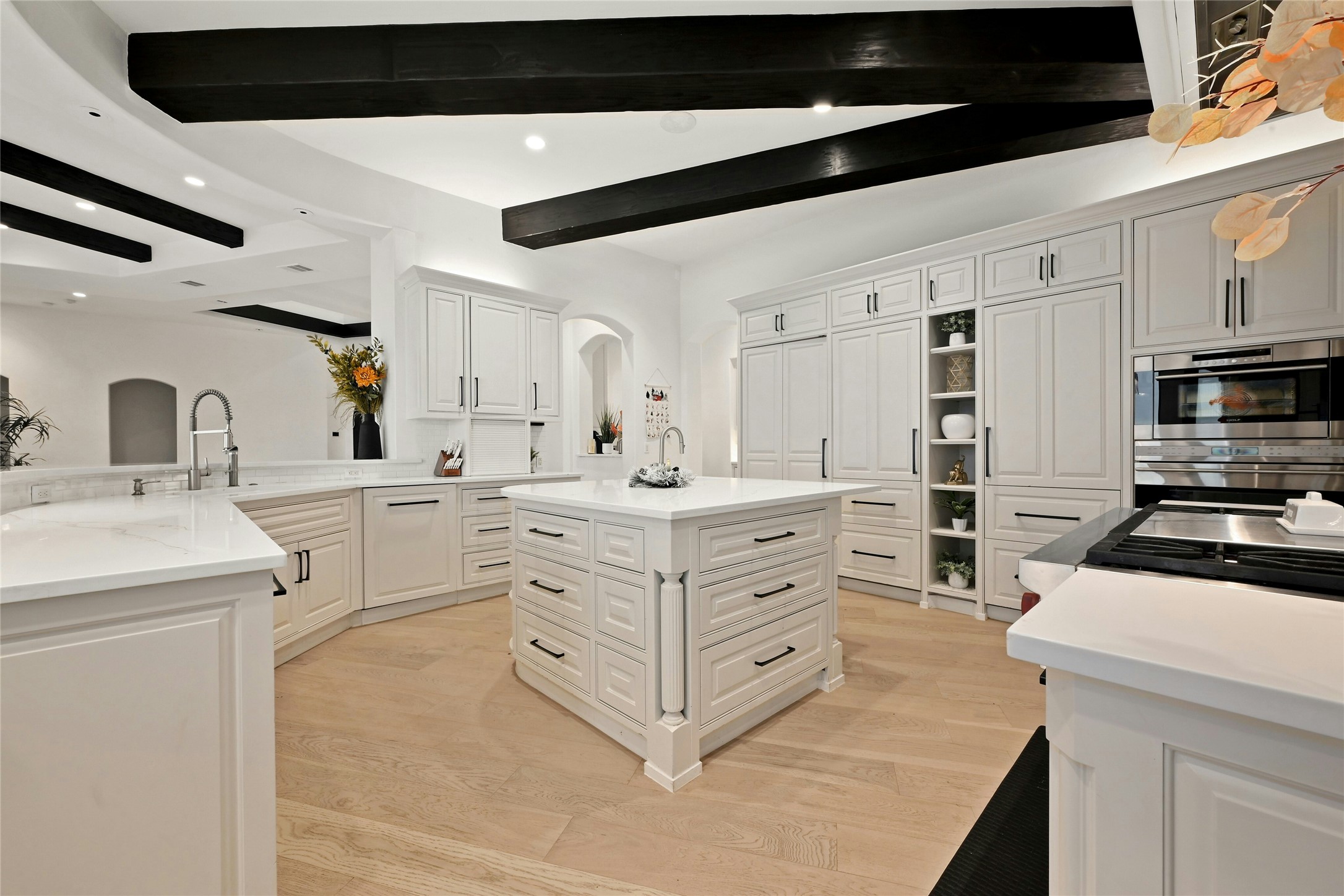16012 Canard Circle Austin, TX 78734 - Photo 9 of 37 a kitchen with stainless steel appliances a sink stove and cabinets