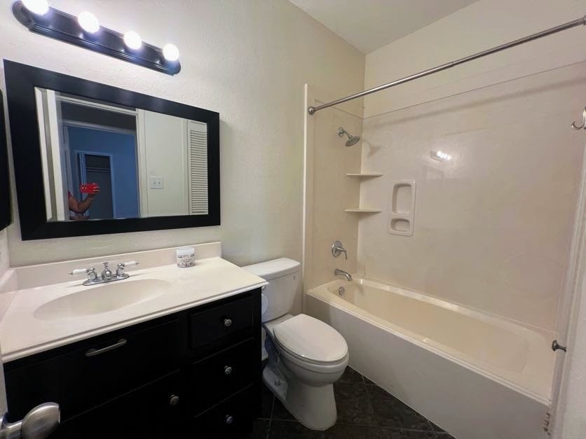 4041 Drake Street, Unit 118 Houston, TX 77005 - Photo 15 of 22 a bathroom with a bathtub shower sink vanity mirror and toilet