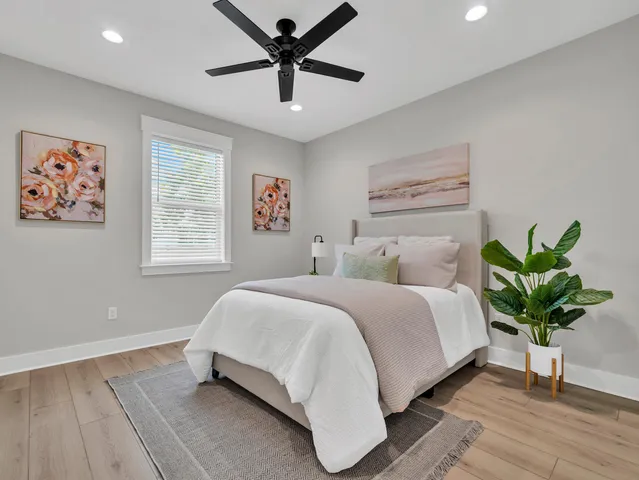 a spacious bedroom with a bed and a table