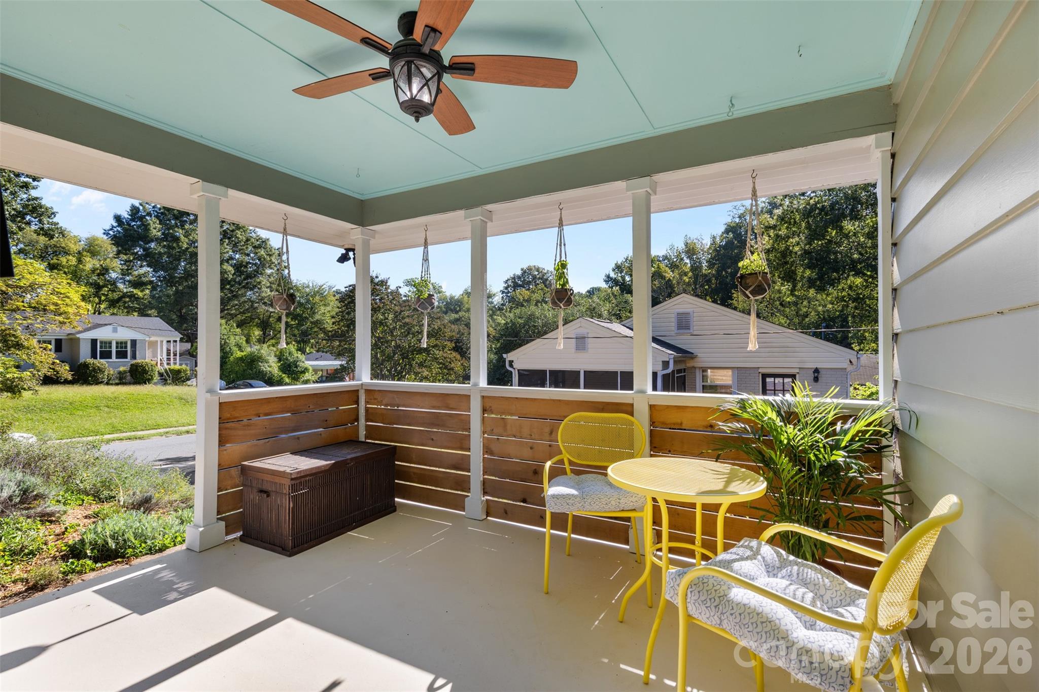 1638 Academy Street Charlotte, NC 28205 - Photo 2 of 30 a view of a patio with a table chairs and a floor to ceiling window
