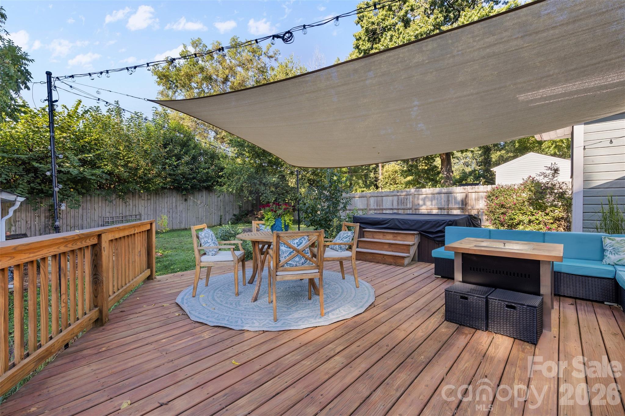 1638 Academy Street Charlotte, NC 28205 - Photo 24 of 30 a view of a patio with table and chairs potted plants with wooden floor