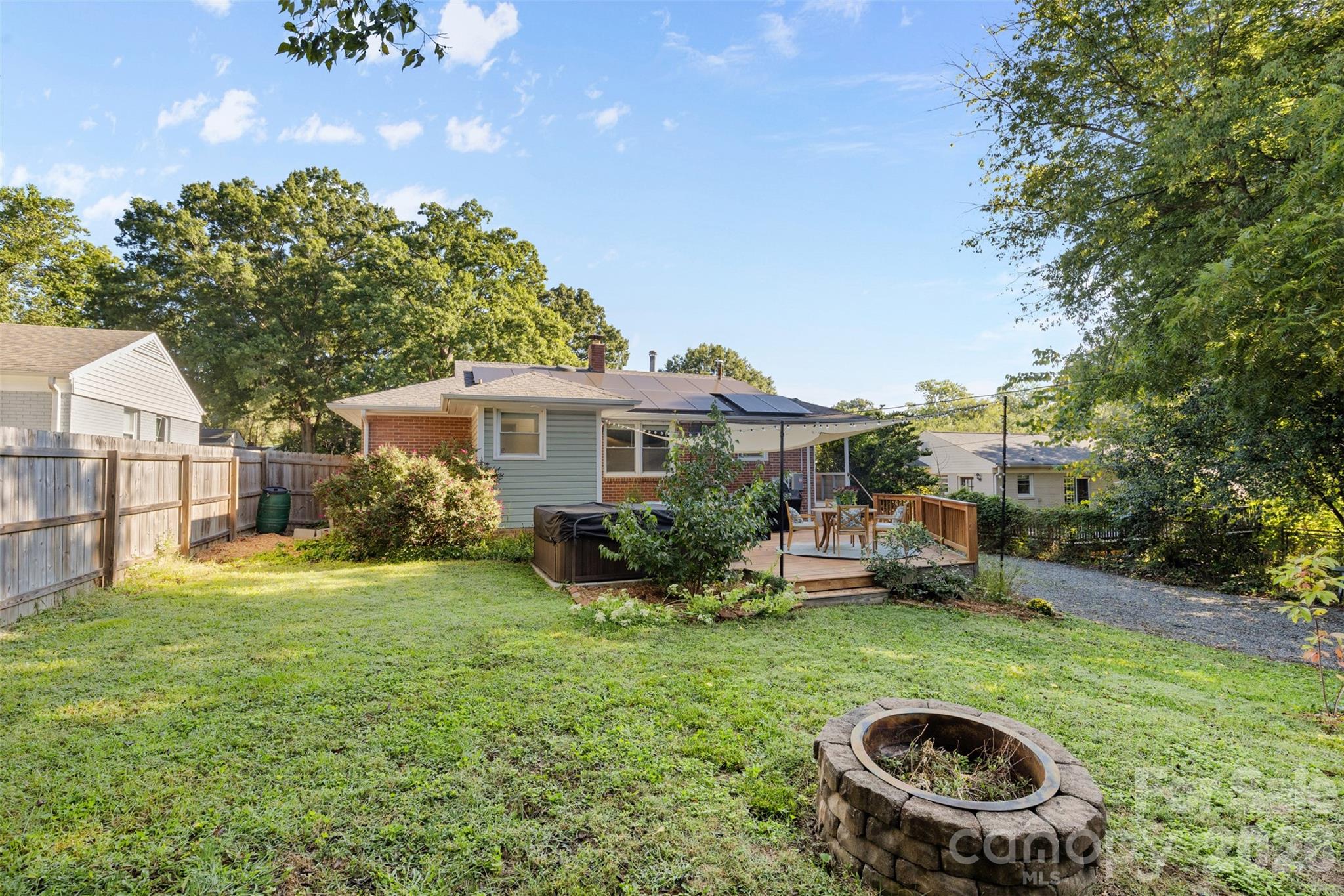 1638 Academy Street Charlotte, NC 28205 - Photo 26 of 30 a view of a house with backyard sitting area and garden