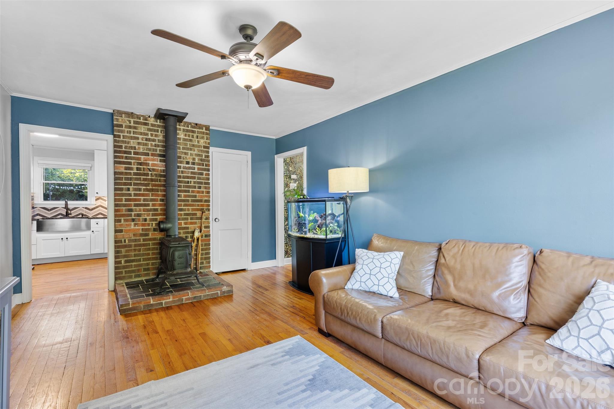 1638 Academy Street Charlotte, NC 28205 - Photo 5 of 30 a living room with furniture and wooden floor