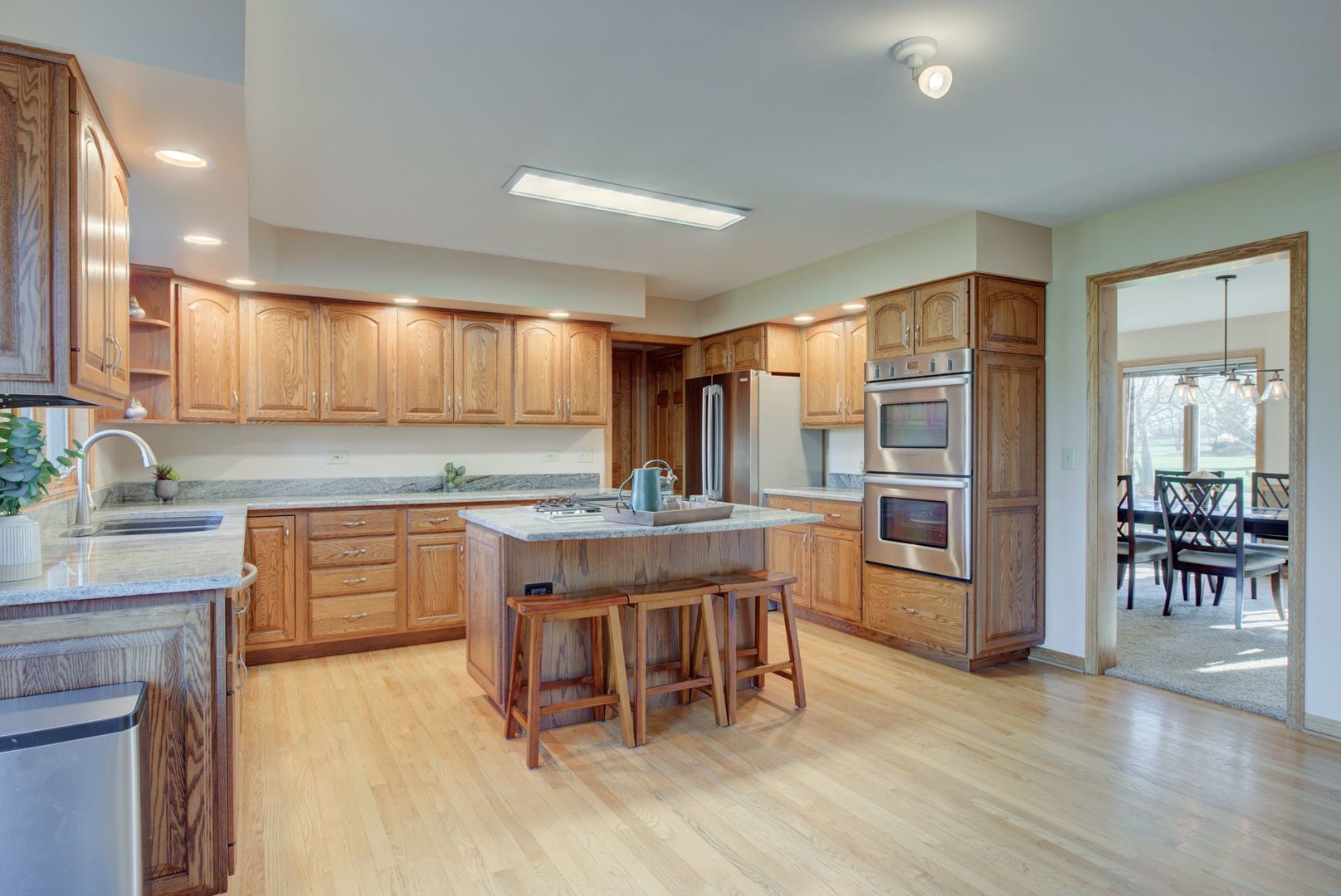 2208 Crystal Circle Crystal Lake, IL 60012 - Photo 11 of 55 a kitchen with a table and chairs in it
