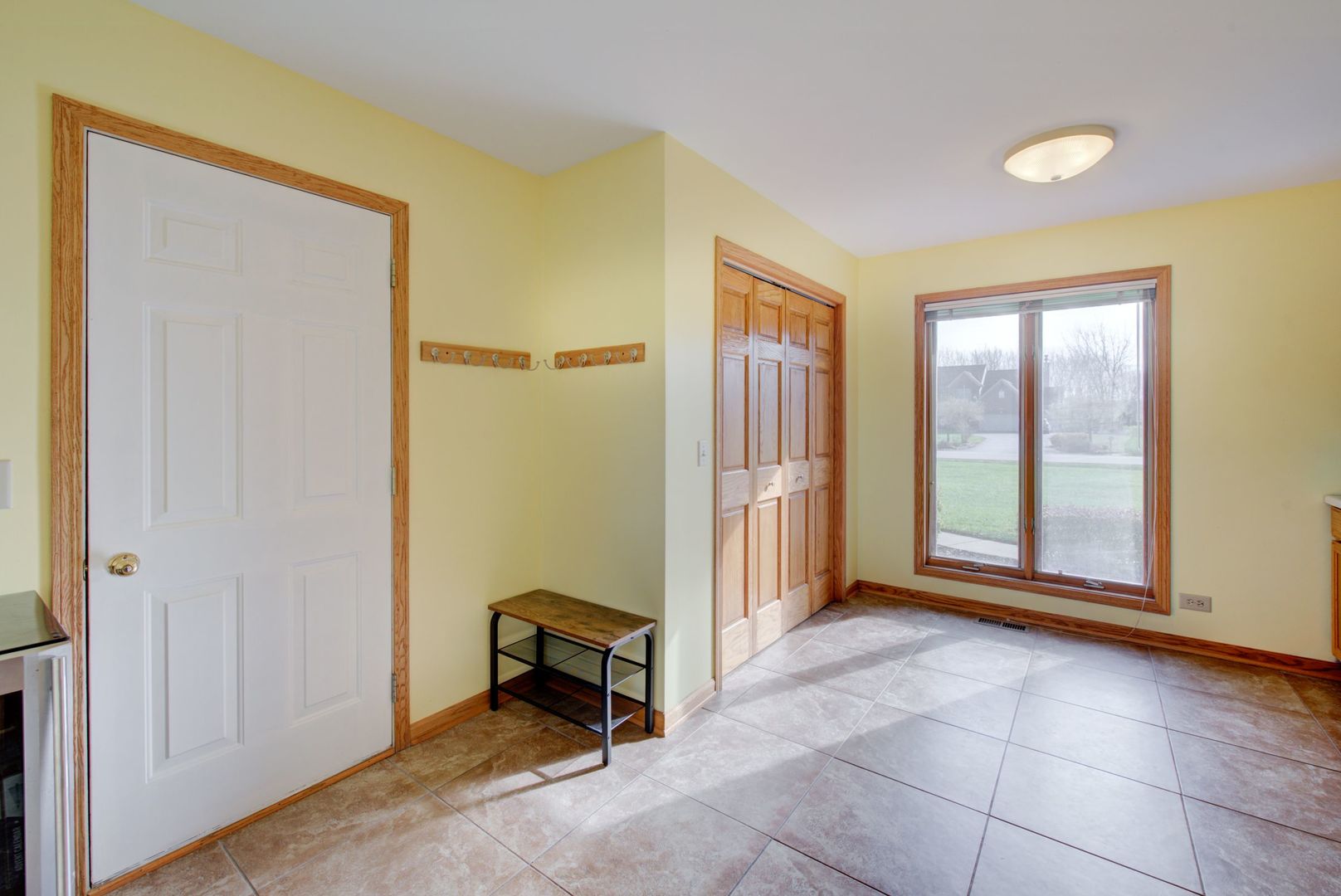 2208 Crystal Circle Crystal Lake, IL 60012 - Photo 19 of 55 a view of a room with a door and a window
