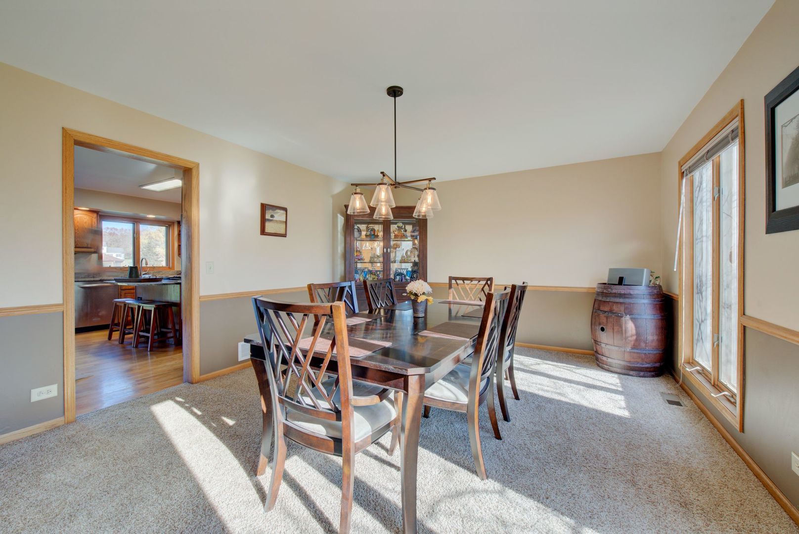 2208 Crystal Circle Crystal Lake, IL 60012 - Photo 20 of 55 a dining room with furniture a chandelier and wooden floor
