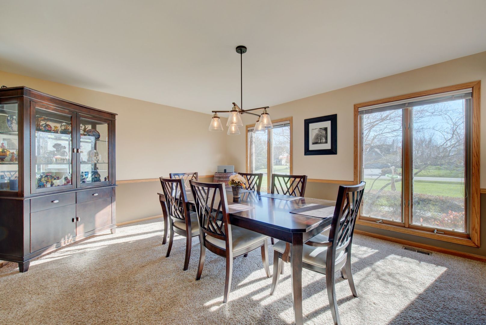 2208 Crystal Circle Crystal Lake, IL 60012 - Photo 21 of 55 a view of a dining room with furniture window and wooden floor