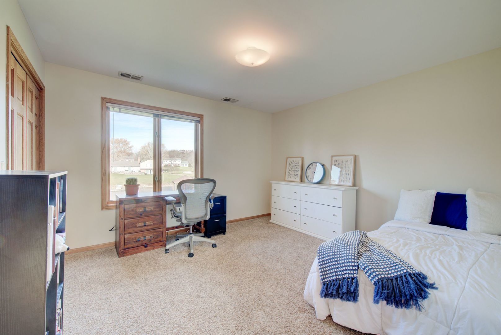 2208 Crystal Circle Crystal Lake, IL 60012 - Photo 31 of 55 a bedroom with furniture and a window