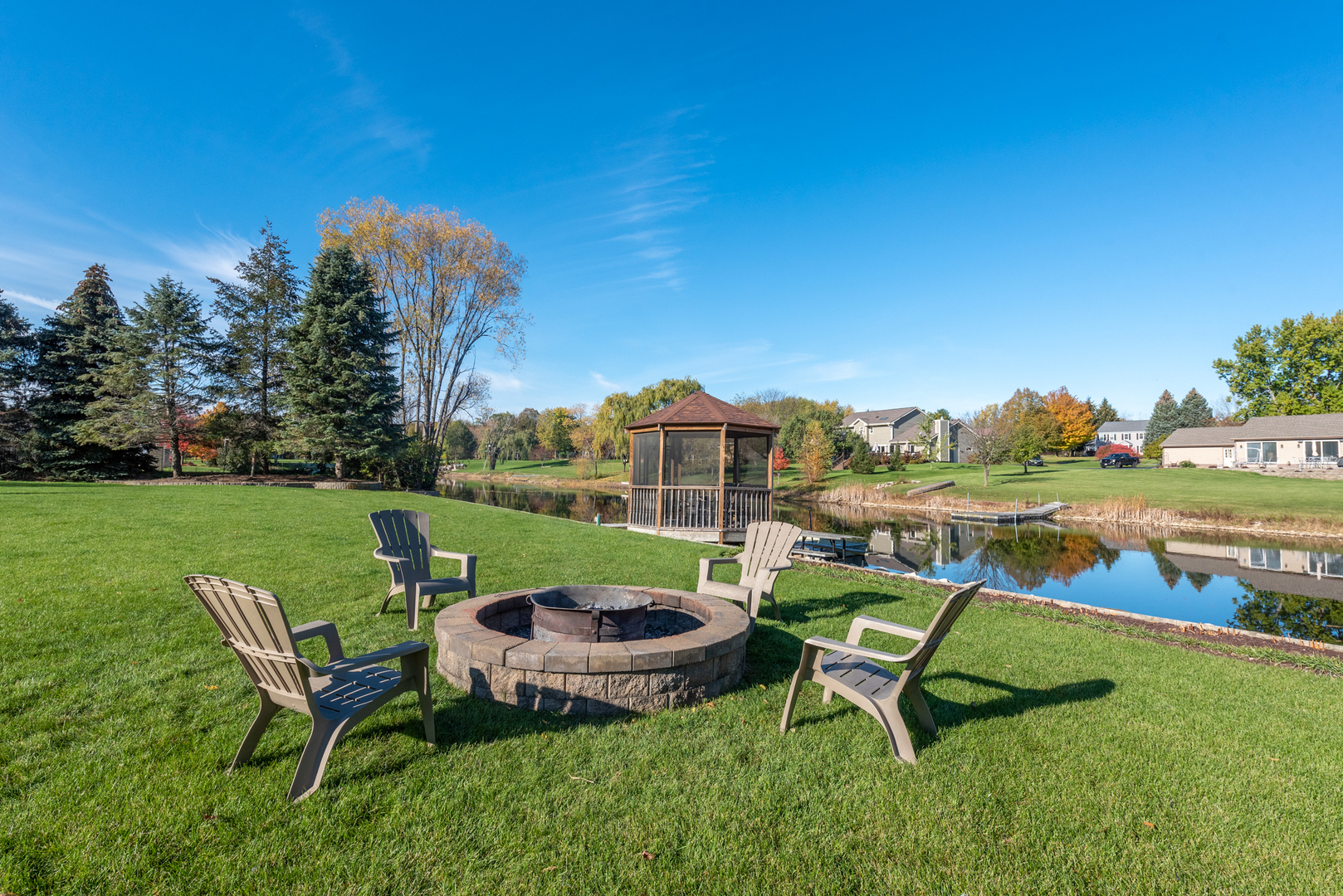 2208 Crystal Circle Crystal Lake, IL 60012 - Photo 41 of 55 a view of a swimming pool and lounge chairs in the garden
