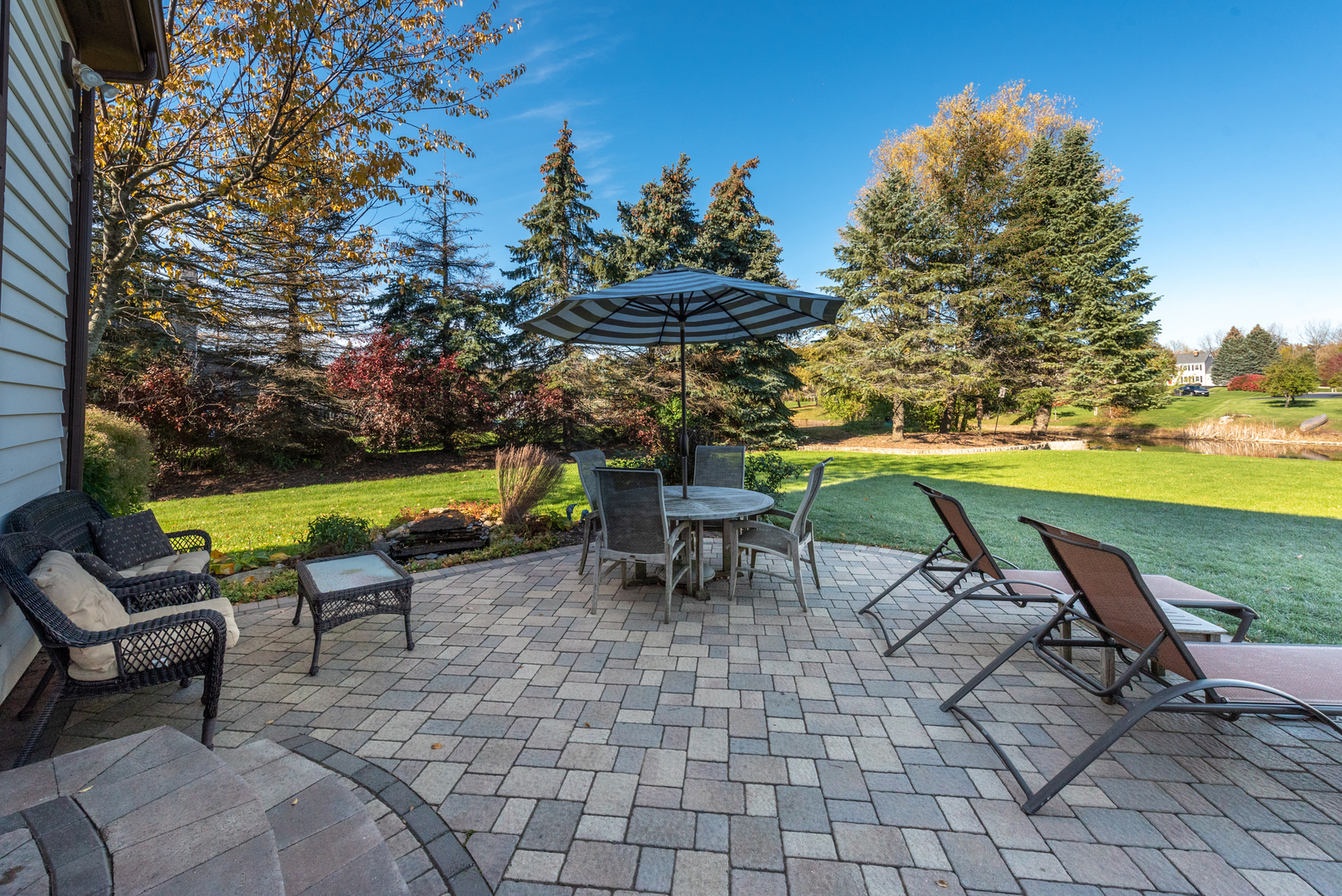 2208 Crystal Circle Crystal Lake, IL 60012 - Photo 42 of 55 a view of a patio with table and chairs and potted plants