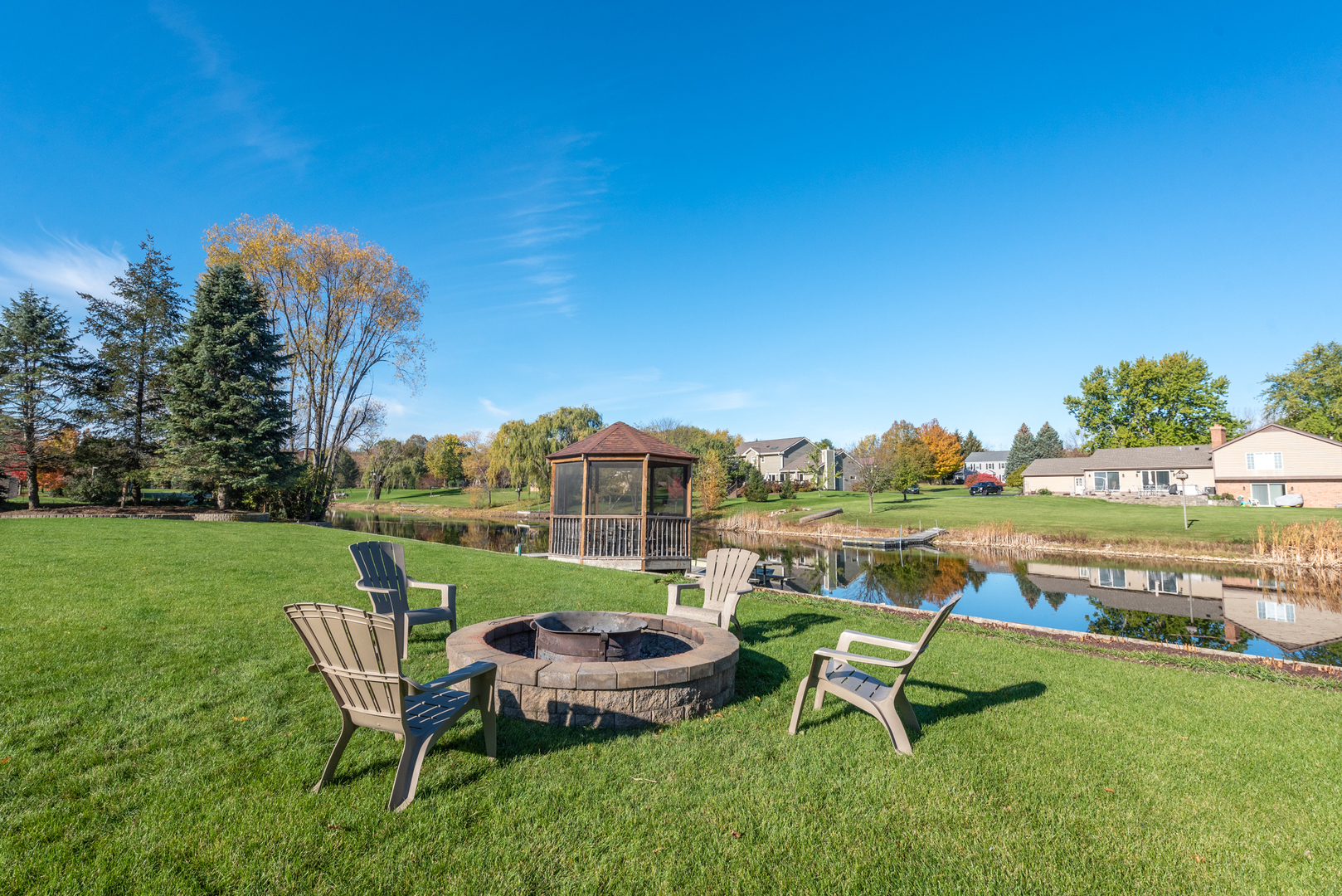 2208 Crystal Circle Crystal Lake, IL 60012 - Photo 44 of 55 a view of a chairs and table on the green field