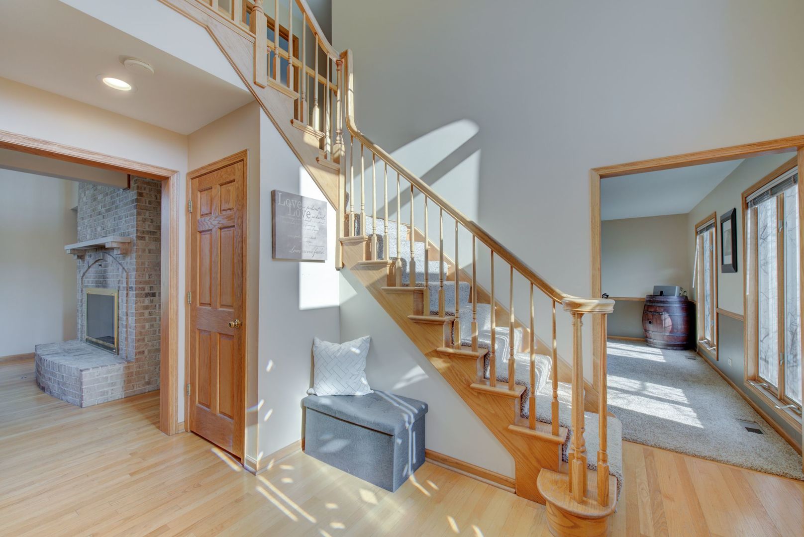 2208 Crystal Circle Crystal Lake, IL 60012 - Photo 6 of 55 a view of staircase with lots of frames and couches