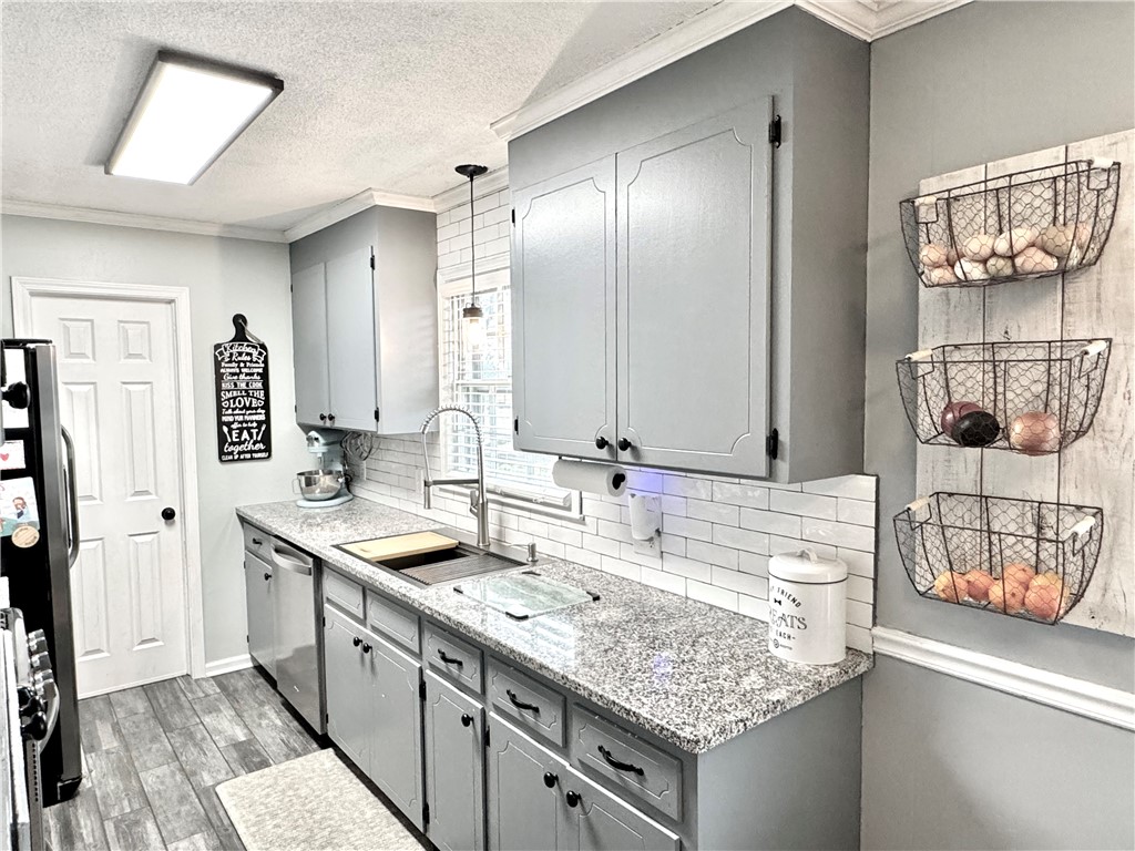 104 Lark Lane Anderson, SC 29625 - Photo 15 of 49 This bright kitchen features ample counter space, modern appliances, and stylish storage solutions.
