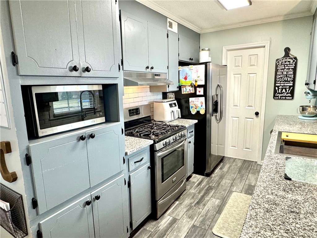 104 Lark Lane Anderson, SC 29625 - Photo 18 of 49 This functional kitchen features ample cabinetry and modern appliances, creating a practical culinary space.