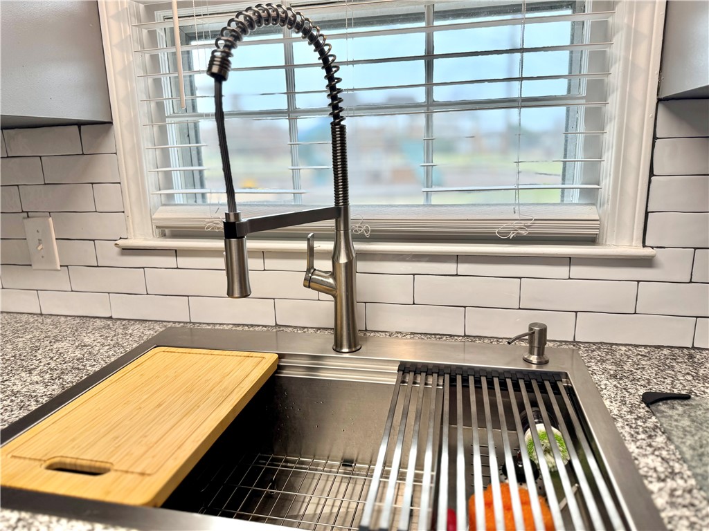 104 Lark Lane Anderson, SC 29625 - Photo 20 of 49 This modern kitchen features a spacious sink and elegant countertops.