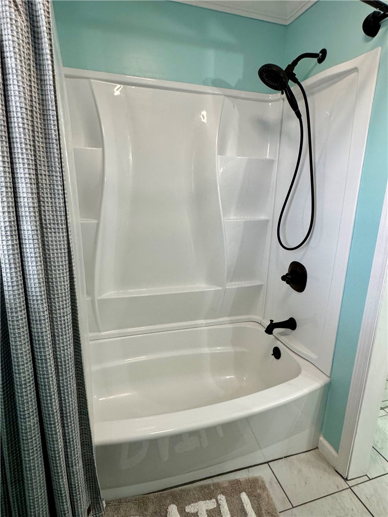 104 Lark Lane Anderson, SC 29625 - Photo 26 of 49 The hall bathroom features a sleek, white shower and tub combination.