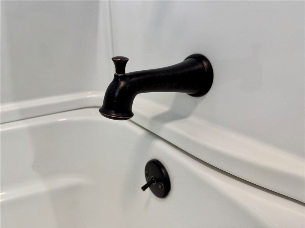 104 Lark Lane Anderson, SC 29625 - Photo 27 of 49 The hall bathroom showcases a pristine tub, perfect for unwinding after a long day.