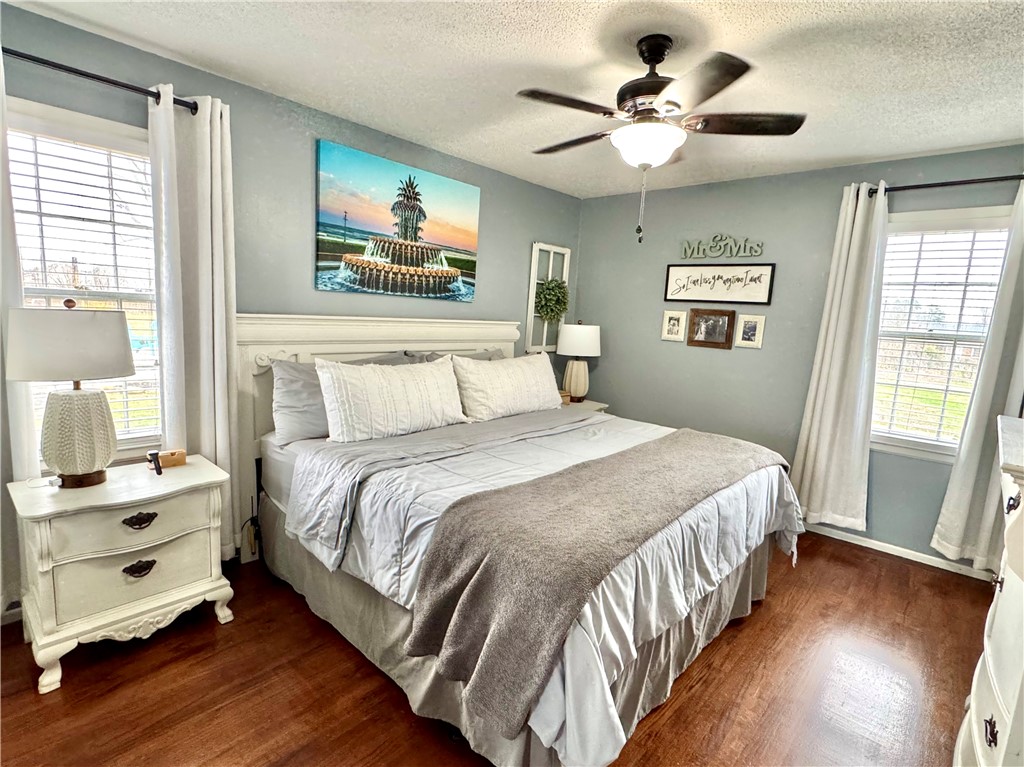 104 Lark Lane Anderson, SC 29625 - Photo 29 of 49 The primary bedroom features warm wood flooring and a refreshing ceiling fan for ultimate comfort.