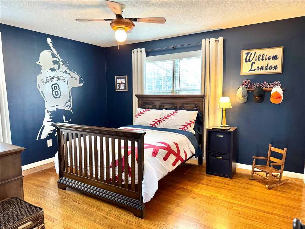 104 Lark Lane Anderson, SC 29625 - Photo 32 of 49 This spacious bedroom 2 features hardwood flooring and double the closets and a ceiling fan/light!